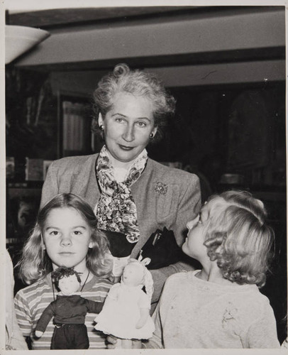 Author Margaret Leighton with a group of girls in the Boys and Girls Room