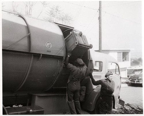 Sanitation workers and a Pak-Mor side loading truck in Santa Monica, February 7, 1956