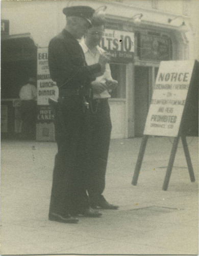 Two men in front of Eddie's Chili Villa on the Ocean Park Promenade at 2930 Ocean Front, opened in June 1932