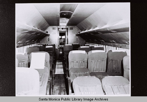 Douglas Aircraft Company DC-7 interior showing seats and cockpit, July 17, 1961