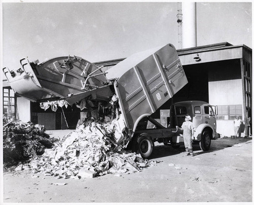 Trash being dumped out of a sanitation truck in Santa Monica, Calif