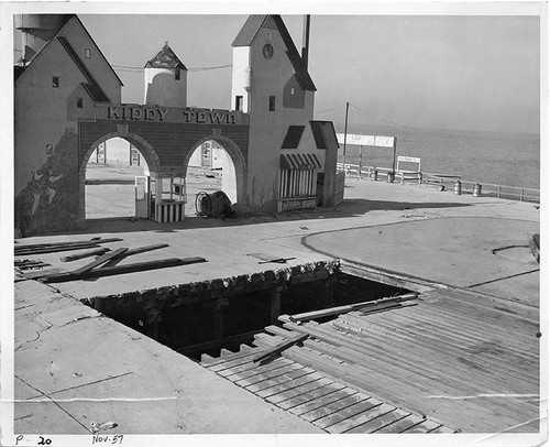 Half-demolished Kiddy Town area at Ocean Park Pier while the site was in process of becoming Pacific Ocean Park, November 1957, Santa Monica, Calif