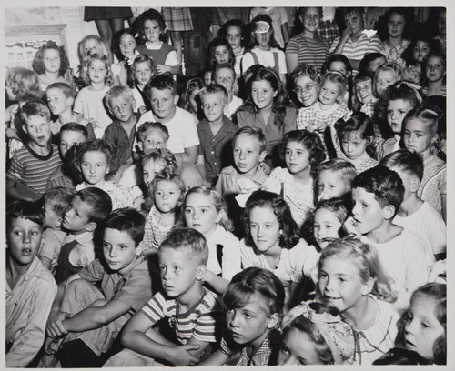 Children watching a performance in the Boys and Girls Room