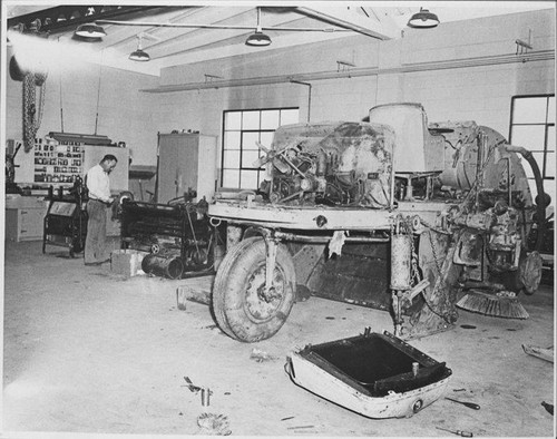 Major repair to a mechanical street sweeper at the Santa Monica City Yards shop