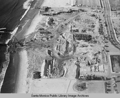 Sand berms near the remains of the Pacific Ocean Park Pier looking north to a beach parking lot, January 23, 1975, 2:30 PM