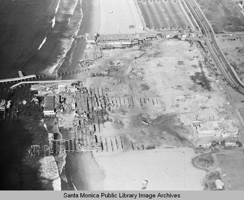 Aerial view of the remains of the Pacific Ocean Park Pier, Santa Monica looking north, November 26, 1974, 10:30 AM