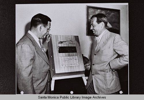 Santa Monica Mayor Mark T. Gates with Donald Douglas of Douglas Aircraft Company and a commemorative scroll for President Harry S. Truman