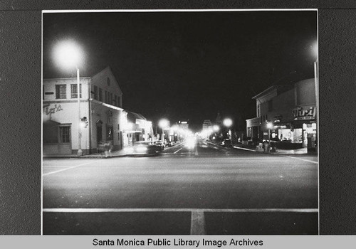 Street lights (before mercury vapor lights) looking toward Thrifty Drugstore from Wilshire Blvd. and Fourth Street, Santa Monica, Calif., April 11, 1955