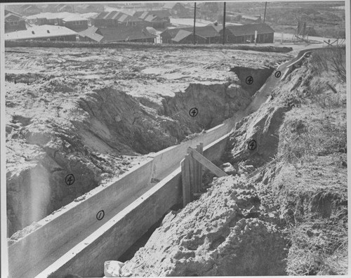 Storm damage to the drain canal on the southwest slope of the Santa Monica Municipal Airport caused by rain on November 22, 1952