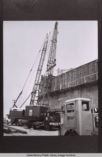Heisler & Woods (El Monte, California) and Vinnell heavy equipment by the Santa Monica Civic Auditorium construction site, July 1957