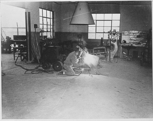 Man working in the welding and blacksmith shop at the Santa Monica City Yards