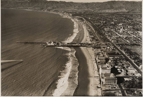 Aerial view of the Santa Monica Pier and La Monica Ballroom looking north to the Santa Monica Mountains, January 3, 1931