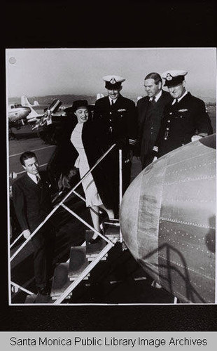Ann Richards christens the first post-war DC-4 delivered to a foreign customer, Australia National Airways, at Clover Field in Santa Monica:the airplane was christened with the Aborigine name "Amana."