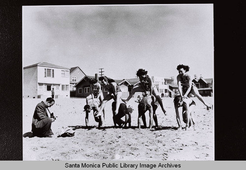 Douglas Aircraft Company employees are photographed enjoying recreation time "Life at the Beach" during World War II