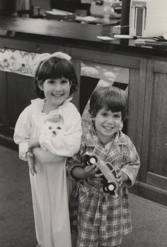 Two children with toys at the Ocean Park Branch Library Twilight Story Time in Santa Monica