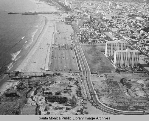 Looking north from the remains of the Pacific Ocean Park Pier to the Santa Monica Shores Apartments and Santa Monica, January 31, 1975, 2:30 PM