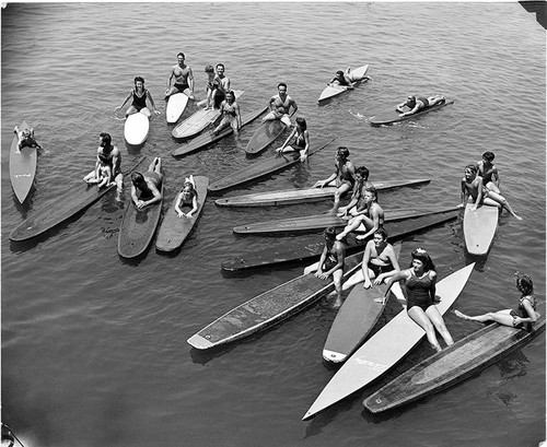 Members of the Manoa Paddle Board Club on paddle boats, Santa Monica, Calif