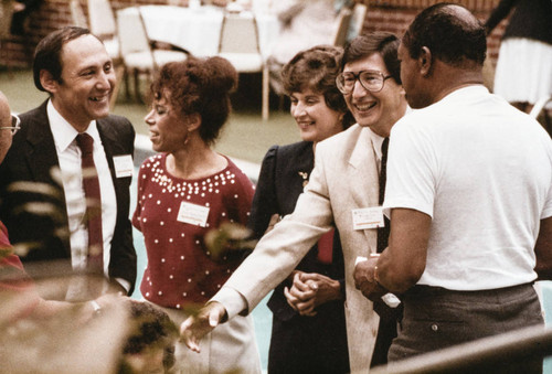 Santa Monica Mayor Ken Edwards (far left), Los Angeles Mayor Tom Bradley (far right with back towards camera) and others at the Olympic Torch Relay breakfast on July 21, 1984, Santa Monica, Calif