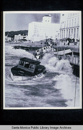 Fishing boats washed ashore at Santa Monica near the Del Mar Club including the 40 foot Sea-Wolf owned by W.I. Wilson of Newport (from the Los Angeles Examiner newspaper)