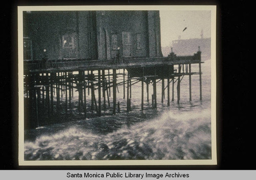 Santa Monica Pier and the La Monica Ballroom being wrecked by storm