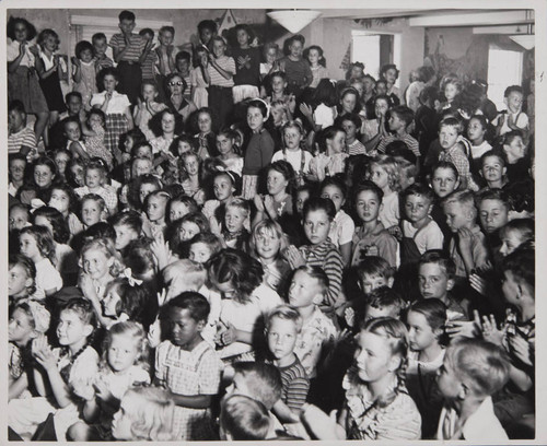 Children watching a performance in the Boys and Girls Room