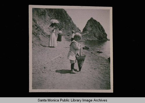 Family on the coast road at Sugar Loaf Rock, Los Angeles County, Calif