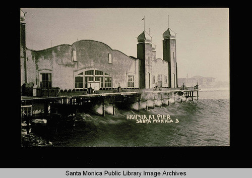 Santa Monica Pier being wrecked by high seas