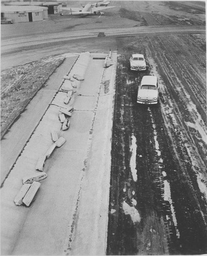 Automobiles near the Santa Monica Municipal Airport drainage project, January 19, 1953