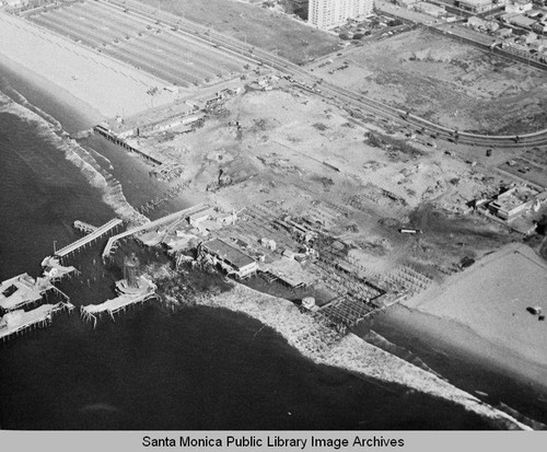 Aerial view of the remains of the Pacific Ocean Park Pier, Santa Monica looking east, November 26, 1974, 10:30 AM