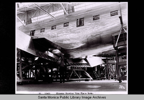 Douglas DC-4 inside hangar, showing wing flaps down, May 23, 1938