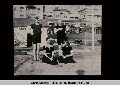 Bathers in front of a beach hotel (Santa Monica, Calif.?)