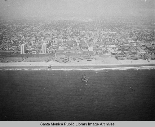 View of the remains of the Pacific Ocean Park Pier and Santa Monica Shores Apartments looking east to Santa Monica, July 10, 1975, 2:30PM