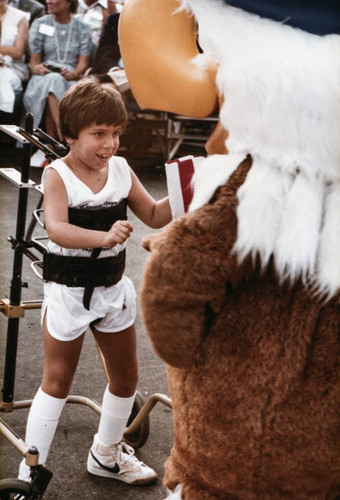 Seven-year-old Michael Bailey and mascot Sam the Eagle on July 21, 1984, Santa Monica, Calif