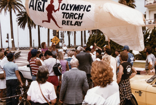 Unfurling the 'AT&T Olympic Torch Relay' banner on July 21, 1984, Santa Monica, Calif