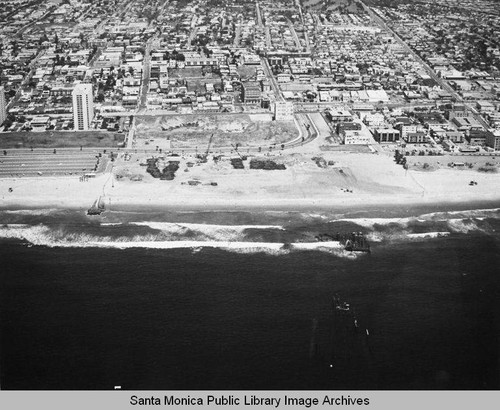 Looking east from the remains of the Pacific Ocean Park Pier toward Ocean Park and the Santa Monica Shores Apartments high-rise, May 7, 1975, 1:00 PM