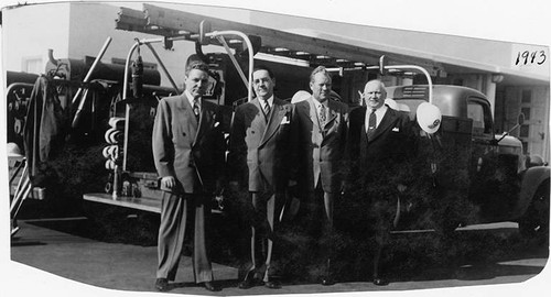 Mayor Leonard Murray (second from right) and other officials in front of a fire truck, Santa Monica, Calif