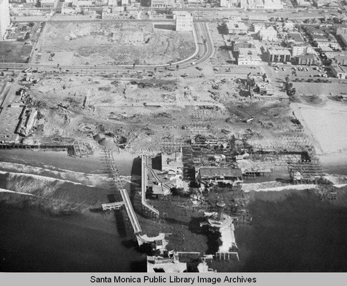 Aerial view of the remains of the Pacific Ocean Park Pier, Santa Monica looking east, November 26, 1974, 10:30 AM