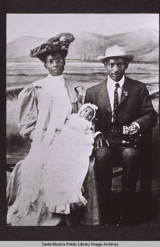 Selena McDonald Brunson and Charles E.A. Brunson holding baby Donald A. Brunson, the first African-American child born in Santa Monica, while posing for a photograph on the Santa Monica Pier in April 1907