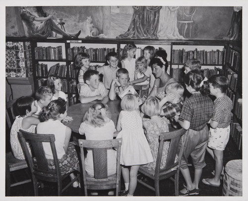 Author Eve Titus reading her book 'Anatole' to young readers