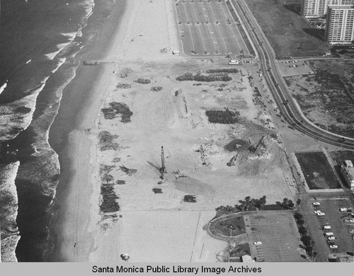 Remains of the Pacific Ocean Park Pier looking north toward the Santa Monica Shores Apartments, April 3, 1975, 11:00 AM