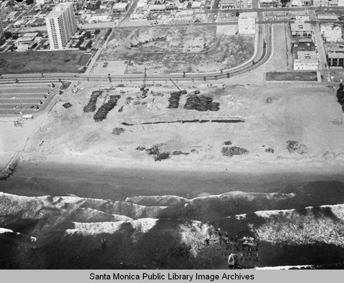 Looking east from the remains of the Pacific Ocean Park Pier toward Ocean Park and the Santa Monica Shores Apartments high-rise, April 24, 1975, 2:10 PM