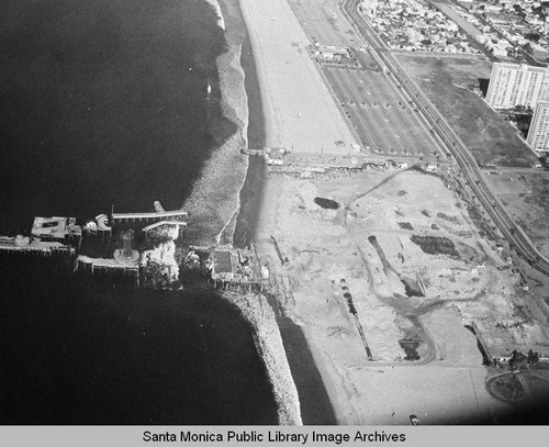 Aerial view of the remains of the Pacific Ocean Park Pier, Santa Monica looking north, January 3, 1975, 10:00 AM