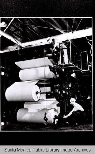 Rolls of blank paper loaded on the press for the "Douglas Airview News" (published by the Douglas Aircraft Company)