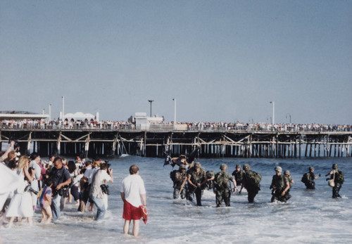 People snapping pictures during the reenactment of D-Day landing, Santa Monica, Calif