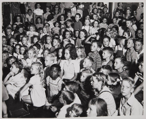 Children watching a performance in the Boys and Girls Room