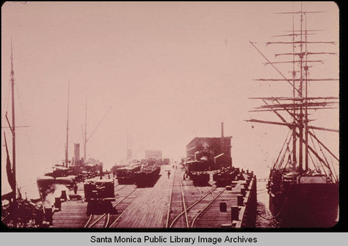 Long Wharf, Santa Monica, Calif. with three steamers on the left, square rigger on the right