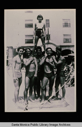 Muscle Beach gymnasts with Paula Unger Boelsems on top of the pyramid, Santa Monica, Calif