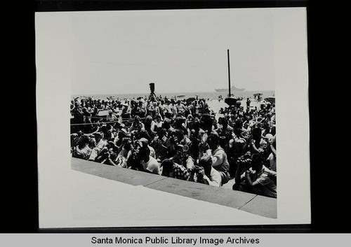 Muscle Beach crowd with cameras on July 4, 1956, Santa Monica, Calif
