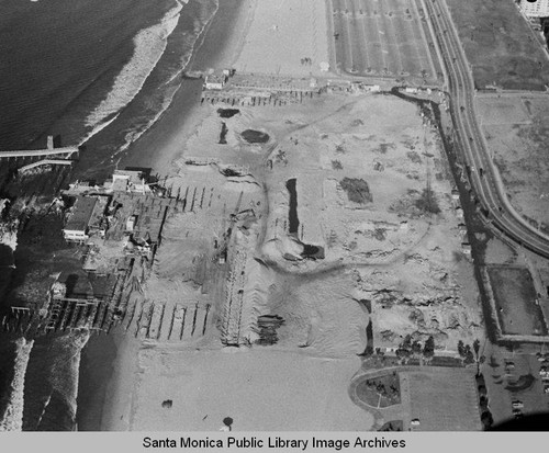 Aerial view of the remains of the Pacific Ocean Park Pier, Santa Monica looking north, December 23, 1974