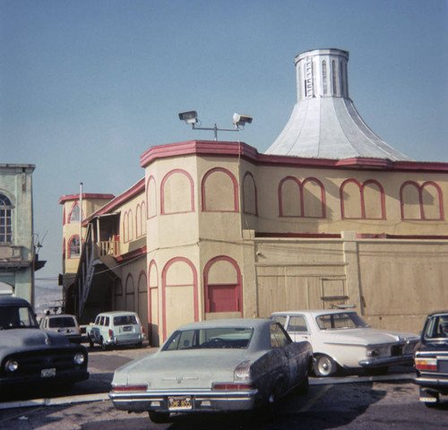 Cars parked near the Merry-go-round building on Santa Monica Pier